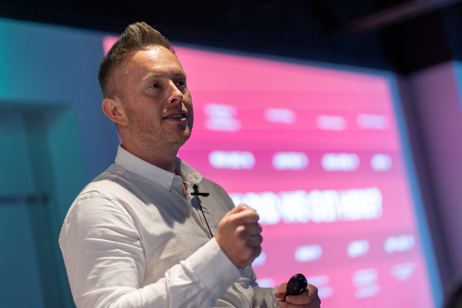Russ Danks speaking on stage